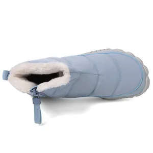 Close-up of light blue winter snow boot with waterproof nylon and warm fleece lining