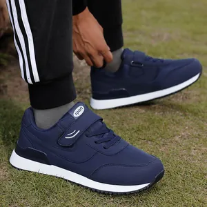 Dark blue lightweight walking sneakers for elderly with non-slip white soles in outdoor use