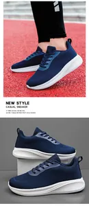 Détails des baskets homme en maille respirante bleue avec semelle blanche sur une piste