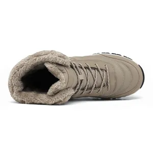 Detail view of khaki winter snow boots featuring warm faux fur lining and durable lace-up closure