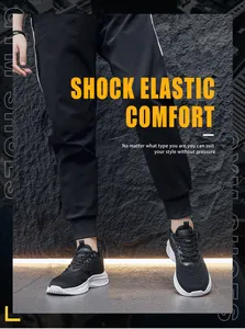 Detail view of breathable black mesh upper and thick white cushioned sole on running shoes