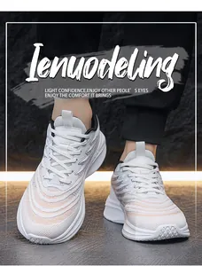 Detail view of white breathable mesh sneakers featuring wavy orange accents and thick soles