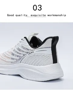 Detail of white mesh running shoe showing purple orange accents and JGAK logo branding