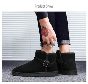 Detail showing matte suede finish and metal buckle strap on classic black winter snow boots