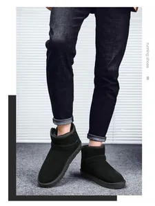 Detail of classic black suede snow boots with thick fur lining and anti-slip sole