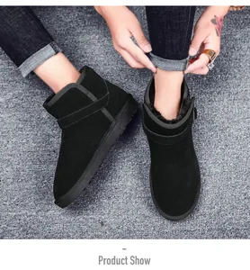 Detailed close-up of black suede snow boots with metal buckle and warm faux fur lining