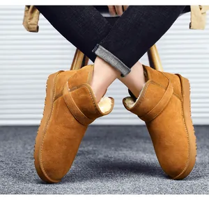 Detail of classic brown suede snow boots with thick faux fur lining and non-slip sole