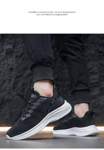 Detail of black breathable knit upper and white cushioned sole on men's running shoes