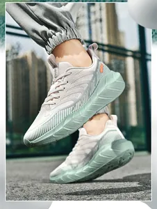 Detailed close-up of breathable mesh running shoes with cushioning EVA sole and mint accents