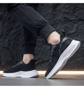Side view of lightweight black knitted running shoes for men with thick white cushioned sole