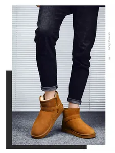 Close-up of brown suede snow boots featuring thick faux shearling lining and buckle detail