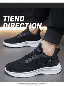 Side view of black mesh men's athletic shoes with white cushioned soles and JGAK logo