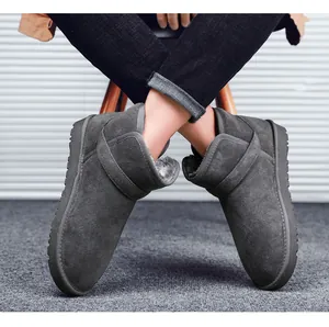 Detail of dark grey leather snow boots with thick faux fur lining and non-slip sole