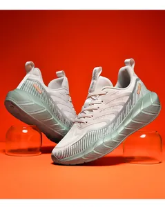 Detail of breathable beige mesh upper and mint green cushioned sole on men's running shoes