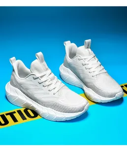 Detailed macro view of white breathable mesh sneakers featuring thick cushioned EVA soles