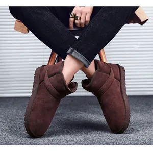 Detail of classic chocolate leather snow boots with thick plush lining for winter warmth