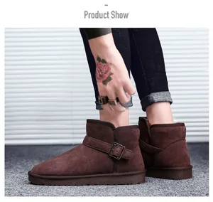Detail view of dark brown suede snow boots featuring side metal buckles and warm lining