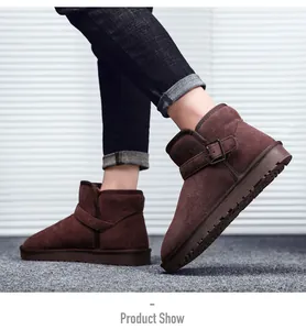Detail view of dark brown suede snow boots featuring metal buckle and non-slip rubber sole