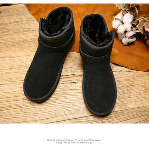 Detail view of black suede snow boots with thick plush lining and side buckle strap