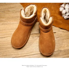 Detail of classic brown suede snow boots showing plush warm lining and stitching quality