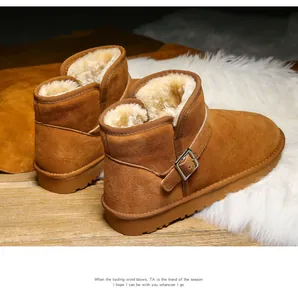 Detail view of brown suede snow boot with thick faux fur lining and metal buckle strap