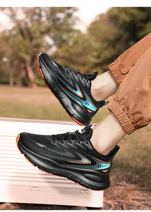 Outdoor shot of men's black winter running shoes with fleece lining and mesh texture