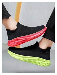 Detail of knitted upper and chunky non-slip sole on these breathable fashion sneakers