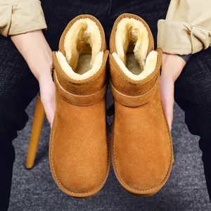 Classic brown suede snow boots with thick sheepskin lining and side buckle detail
