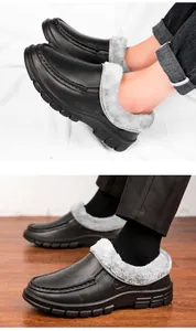 Detail of warm grey faux fur lining and non-slip rubber sole on men's winter leather shoes