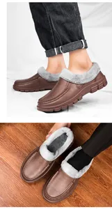 Detailed view of brown winter loafers with plush fur lining and thick non-slip rubber soles