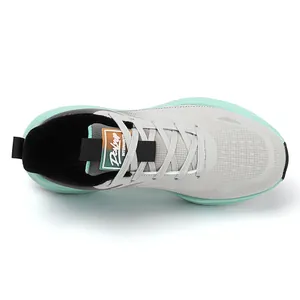 Top view of men's grey running shoes featuring mint green soles and cashmere lining