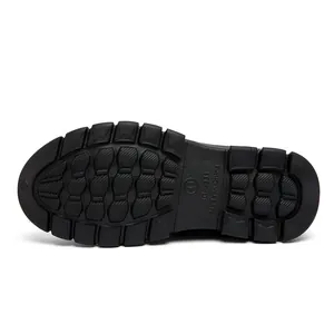 Macro view of non-slip rubber outsole with deep tread and size 41 marking on the sole