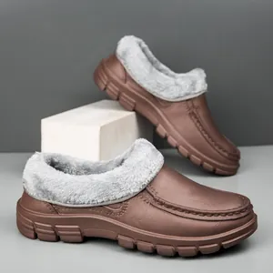 Detailed view of warm fleece lining and non-slip sole on brown winter work shoes