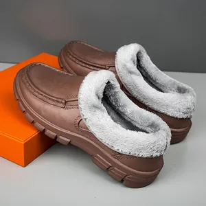 Detail view of brown matte thermal shoes with thick grey faux fur lining and anti-slip sole
