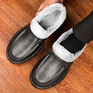 Close-up of men winter leather shoes with thick gray plush lining and anti-slip sole