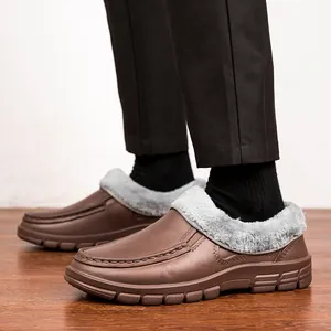 Detail of warm faux fur lining and anti-slip sole on brown winter leather loafers