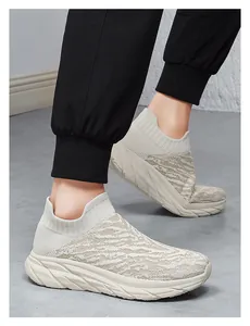 Detail of off-white knitted slip-on sneakers with tiger-stripe texture and thick sole