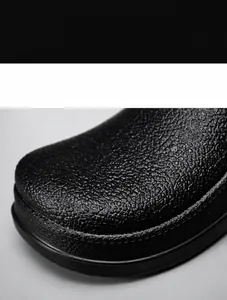 Detail of waterproof non-slip chef shoe showing high-quality black cowhide texture