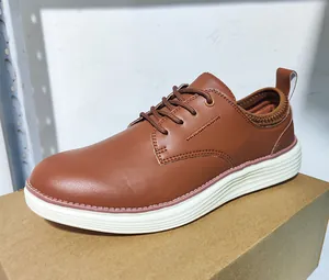 Detailed side view of brown leather casual oxford shoes with durable white rubber soles