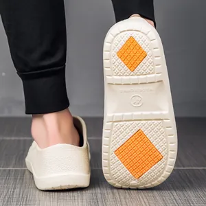 Non-slip waterproof chef work shoes in off-white with orange anti-skid sole grip