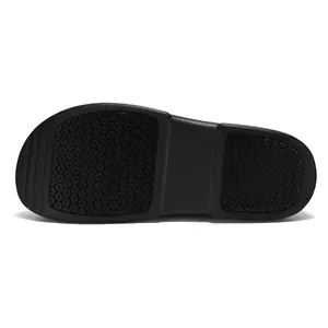 Detailed view of black anti-slip outsole with hexagonal traction pattern for chef shoes