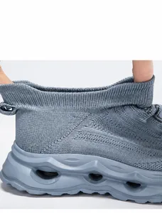 Detail showing the flexible and soft elastic ankle opening of the knit sneaker