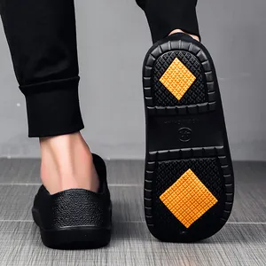 Detailed view of the anti-slip outsole featuring yellow rubber pads and drainage grooves