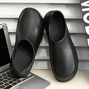 Waterproof non-slip black chef clogs with anti-skid textured sole for kitchen work