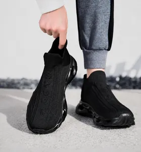 Detail of black knit sock sneakers featuring breathable mesh and cushioning hollow sole