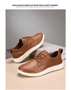 Detail view of brown textured leather casual oxfords with thick white soles on wooden desk
