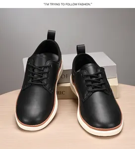 Detail of leather oxford shoes with thick white soles on a minimalist wooden desk