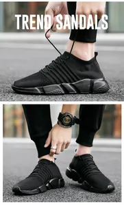 Détail de baskets noires en tricot respirant avec semelle épaisse antidérapante et lacets