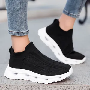 Breathable black fly knit sock sneakers with thick cushioned white sole for men and women