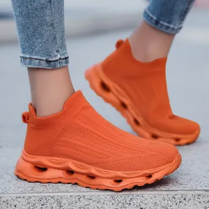 Bright orange breathable knit sock sneakers with thick hollowed-out shock-absorbing soles